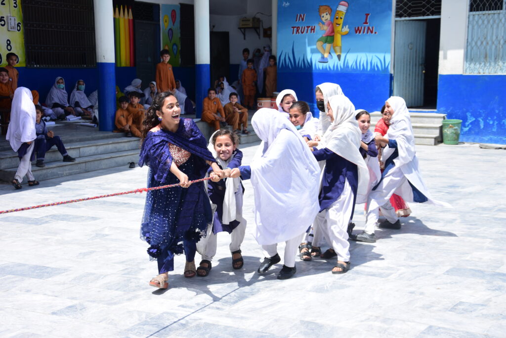 Girls in Pakistan playing during CPI Olympics and storytelling event