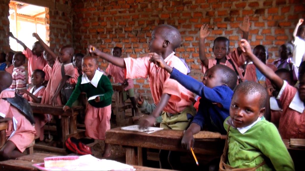 Children at AIDS orphanage in Kenya attending storytelling session