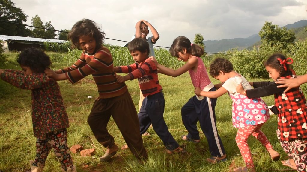 Children playing outdoors during a CPI workshop in Nepal
